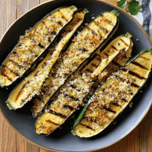 Elevate your summer barbecue with this delightful Grilled Zucchini with Parmesan! This simple yet flavorful recipe features fresh zucchini slices grilled to perfection and topped with melty Parmesan cheese. Perfect as a side dish for any meal or a healthy snack. Save this easy recipe for your next cookout! Enjoy the taste of summer in every bite.