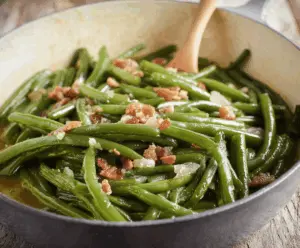 Delicious Southern Style Green Beans cooked with bacon, garlic, and seasonings in a savory, flavorful dish