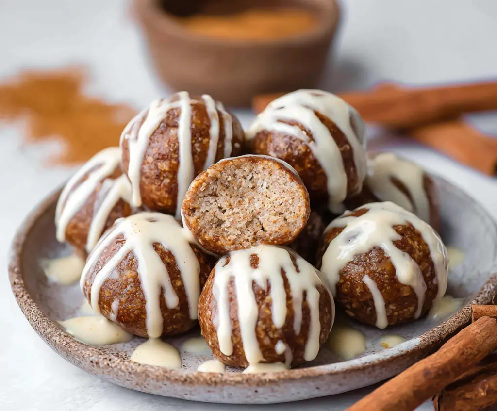 Delicious Cinnamon Roll Protein Bites with frosting on a plate