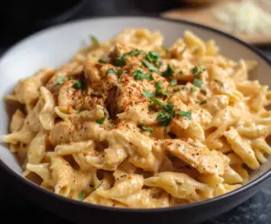 Delicious Crockpot Chicken Pasta with tender chicken and creamy sauce, served in a bowl.