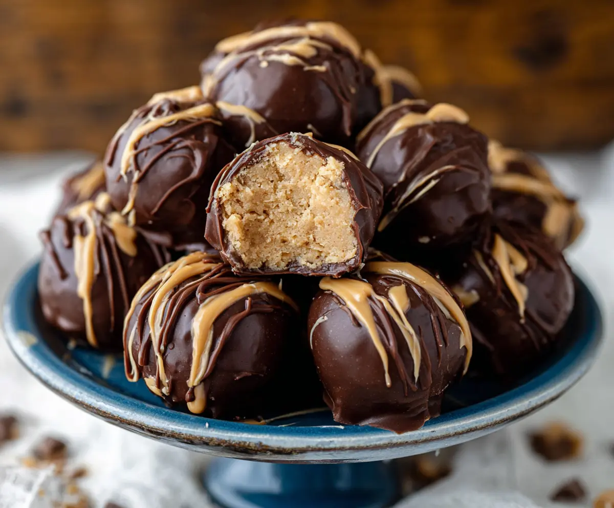 Delicious homemade peanut butter balls coated with chocolate for a sweet treat.