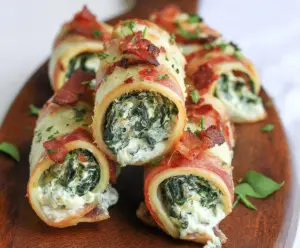 Delicious spinach and bacon cream cheese roll ups served as a savory appetizer.