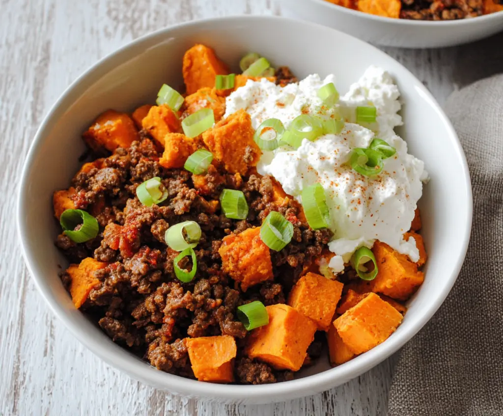 Delicious cottage cheese, sweet potato, and beef dish served on a plate.