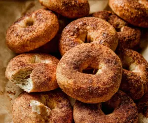 Freshly baked cinnamon bagels with a golden crust and aromatic cinnamon swirl.