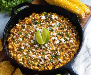 Delicious Mexican Street Corn Skillet Dip topped with cotija cheese and cilantro.