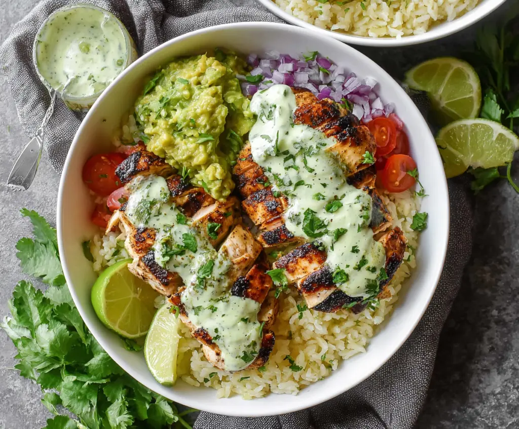 Fresh cilantro lime chicken bowls served with rice and vegetables, perfect for a healthy meal.