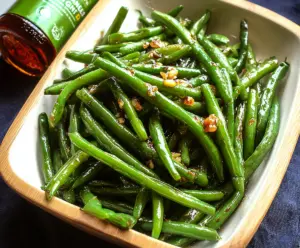 Delicious glazed green beans cooked to perfection with a shiny, flavorful glaze.